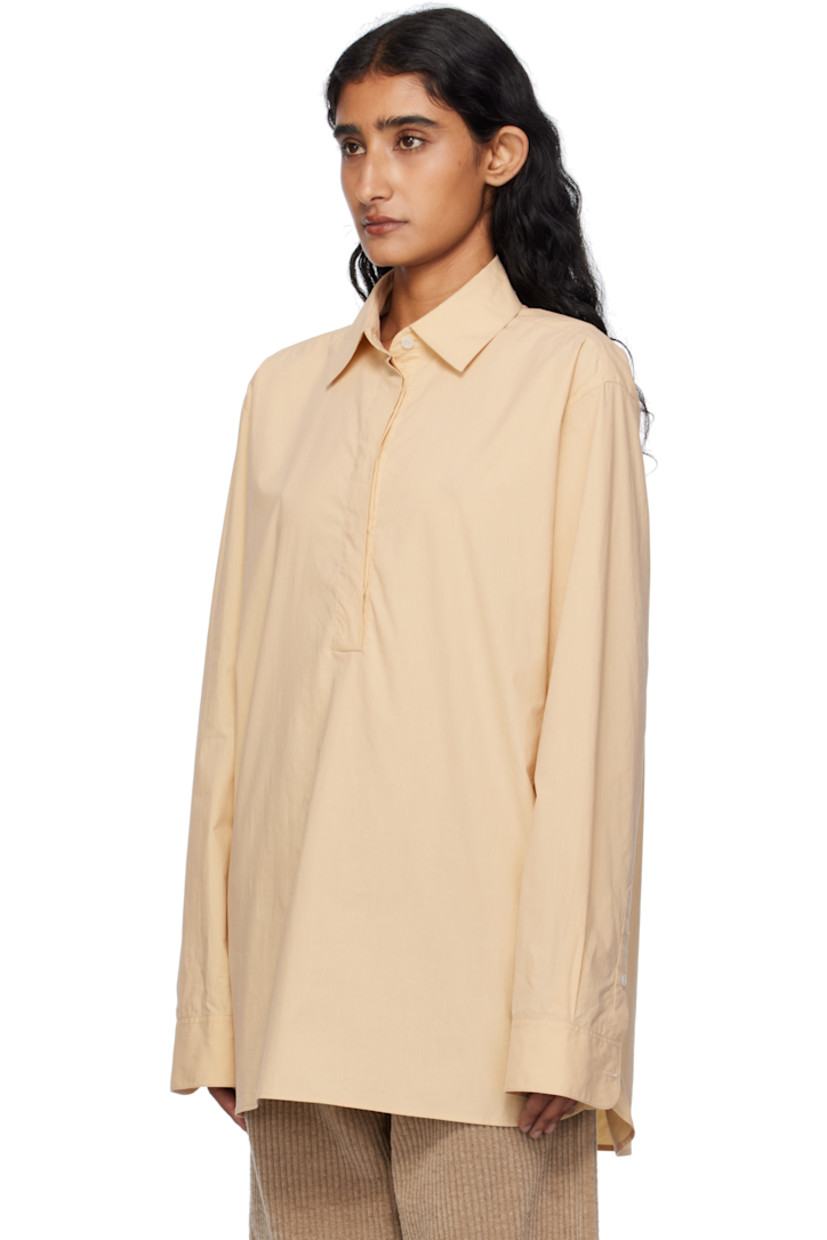 Lightweight sanded cotton poplin shirt. 

· Spread collar
· Concealed five-button placket 
· Shirttail hem 
· Buttoned barrel cuffs
· Mother-of-pearl hardware 

Supplier color: Sand