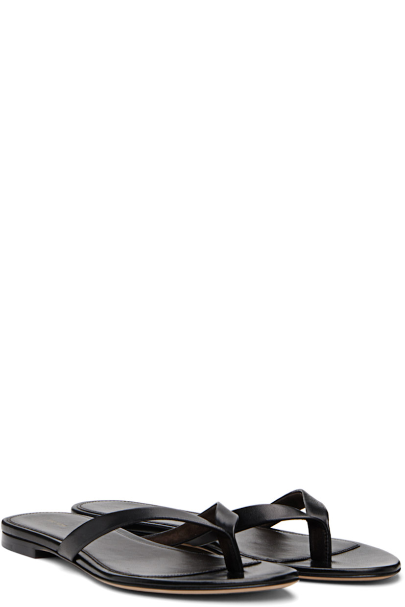 Grained nappa lambskin flip-flops. 

· Open toe
· Thong-style strap at vamp
· Logo embossed at footbed
· Stacked leather heel with rubber injection
· Nubuck sole

Supplier color: Black