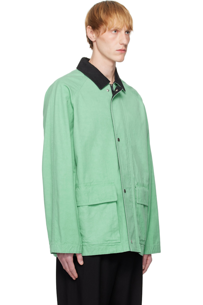 Cotton canvas jacket. 

· Spread collar
· Concealed two-way zip closure
· Press-stud placket
· Flap and welt pockets
· Raglan sleeves
· Storm flap at back
· Patch pocket at interior

Supplier color: Lagoon
