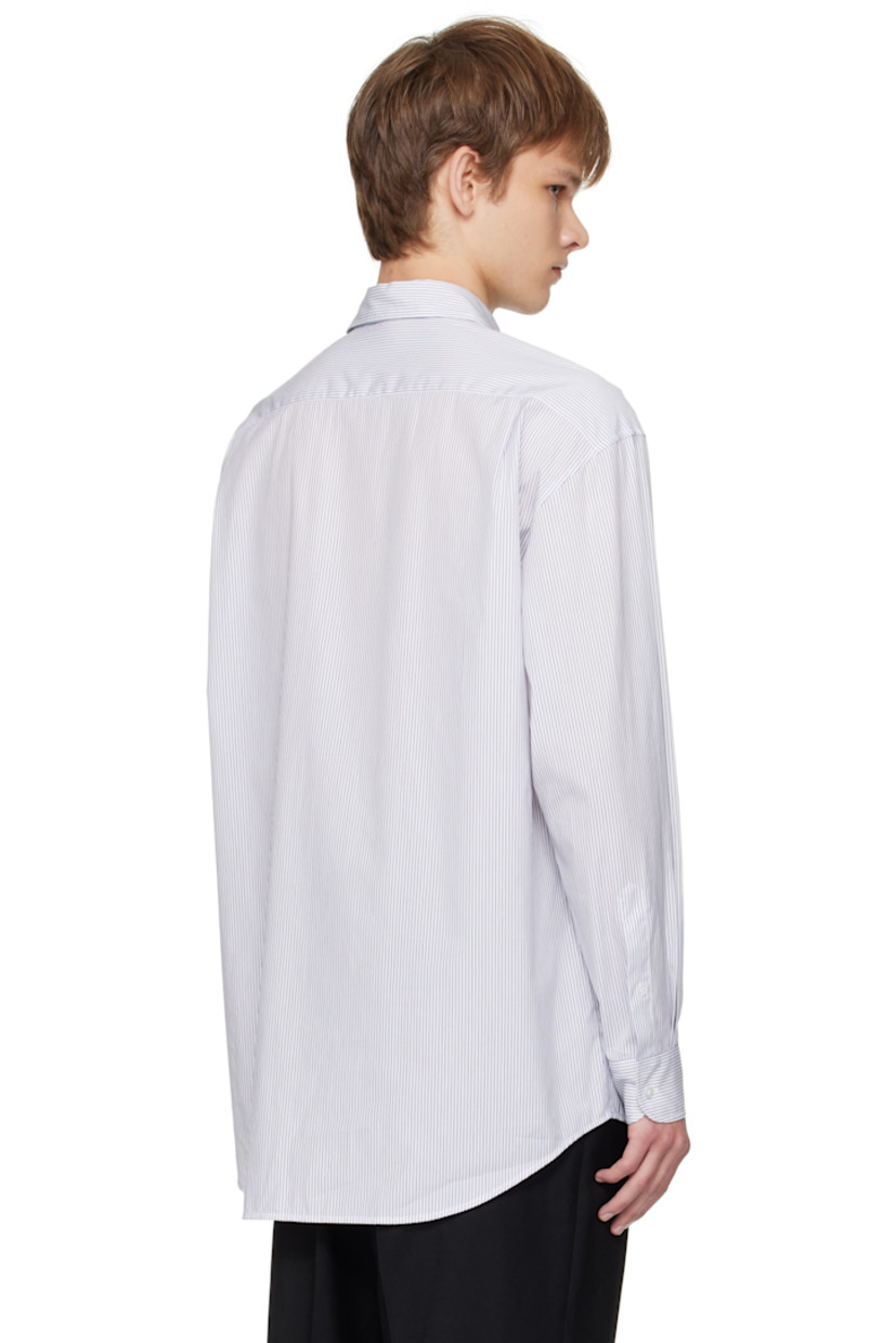 Cotton poplin shirt. 

· Spread collar
· Button closure
· Shirttail hem
· Pleats at buttoned barrel cuffs
· Twin pleats at back yoke 

Supplier color: White