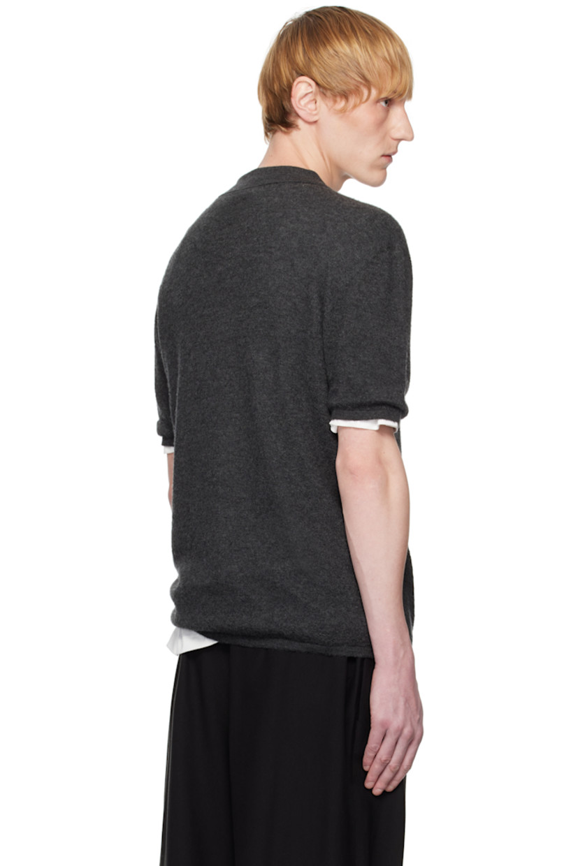 Knit goat cashmere polo. 

· Rib-knit open spread collar, hem, and cuffs
· Dropped shoulders

Supplier color: Charcoal