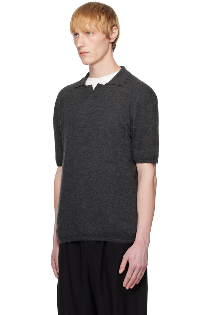 Knit goat cashmere polo. 

· Rib-knit open spread collar, hem, and cuffs
· Dropped shoulders

Supplier color: Charcoal