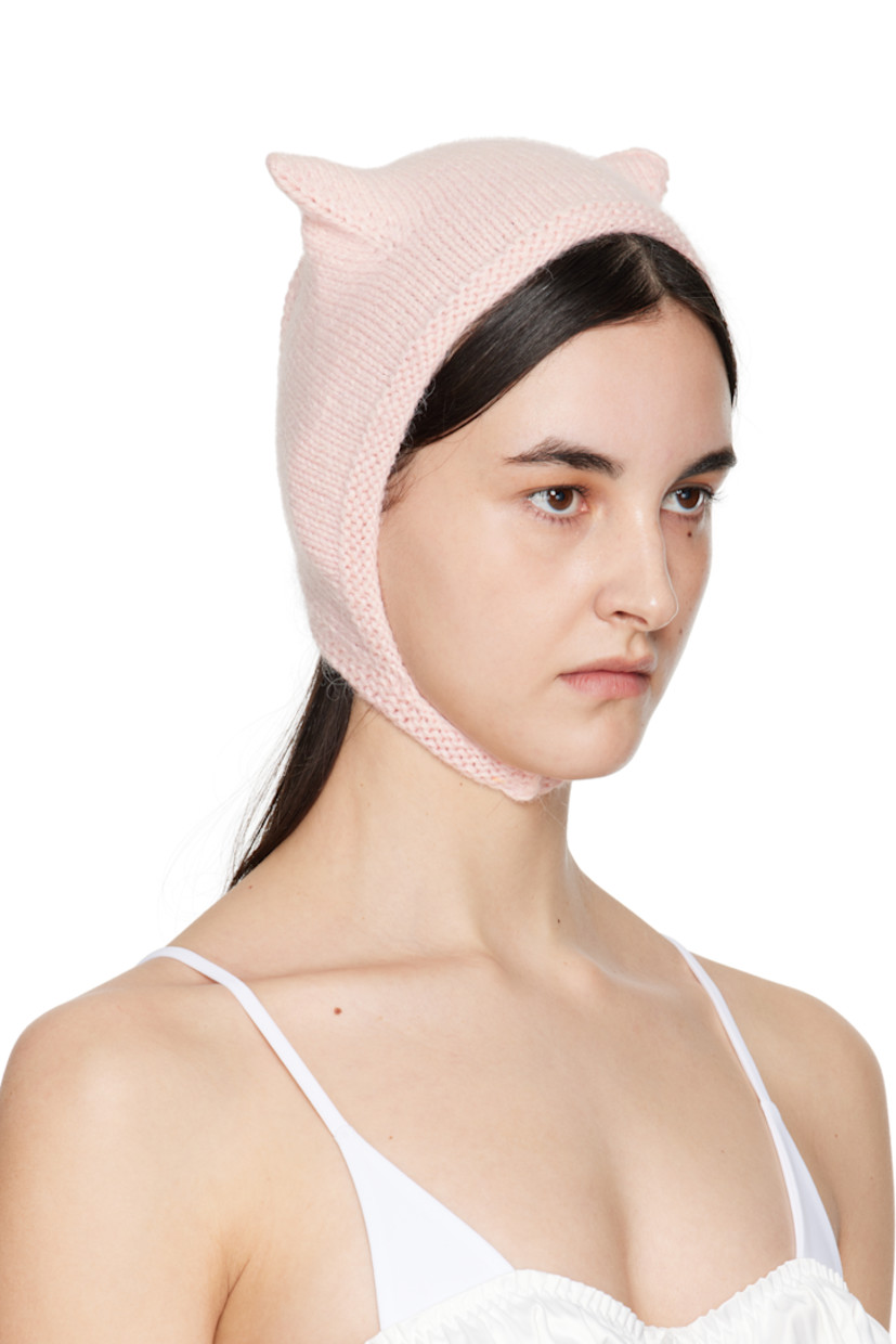 Brushed knit mink wool beanie in pink.

· Ear appliqués at crown
· Hook-eye chin strap

Supplier color: Baby pink

100% mink wool.