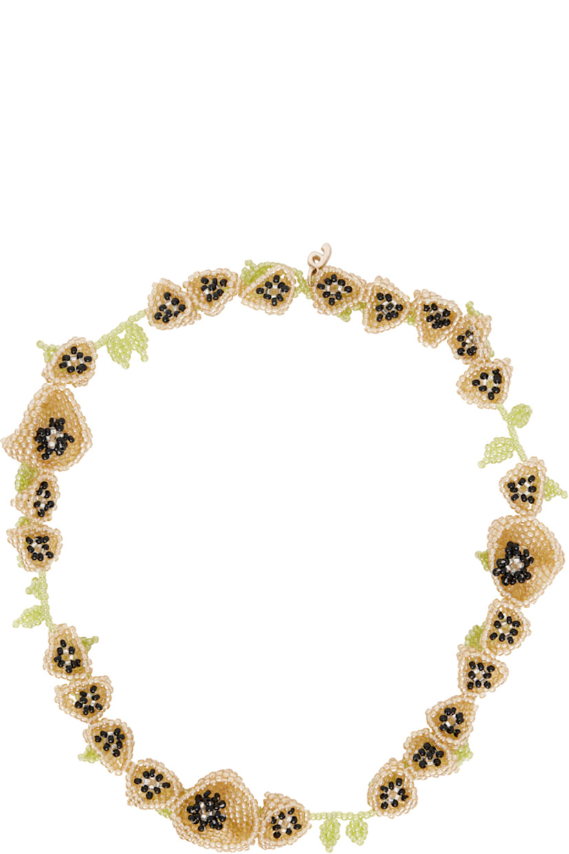 Handcrafted beaded glass necklace in yellow and green.

· Graphic charms at length
· Logo charm at toggle fastening
· L18.5"

Supplier color: Yellow
