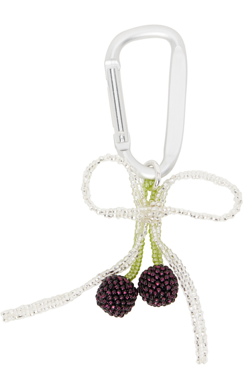 Handcrafted keychain in silver tone.

· Beaded glass charms at drop
· Lanyard-clasp fastening
· H5.5" x W2"

Supplier color: Silver/Purple
