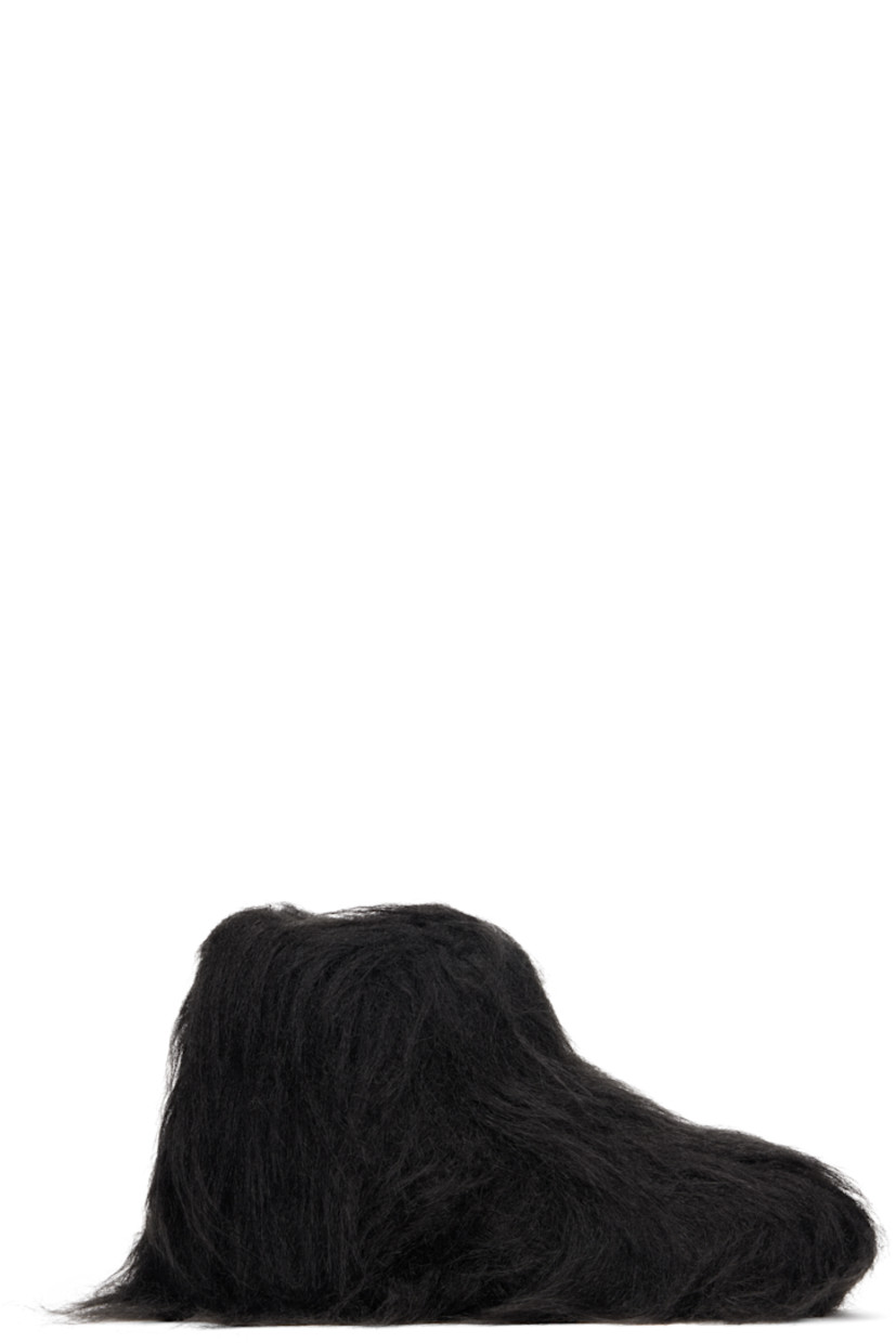 Ankle-high faux-fur boots.

· Padded footbed
· Treaded rubber sole 

Supplier color: Black