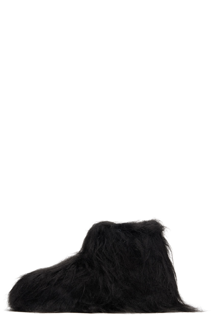 Ankle-high faux-fur boots.

· Padded footbed
· Treaded rubber sole 

Supplier color: Black