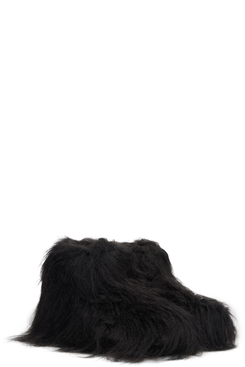 Ankle-high faux-fur boots.

· Padded footbed
· Treaded rubber sole 

Supplier color: Black