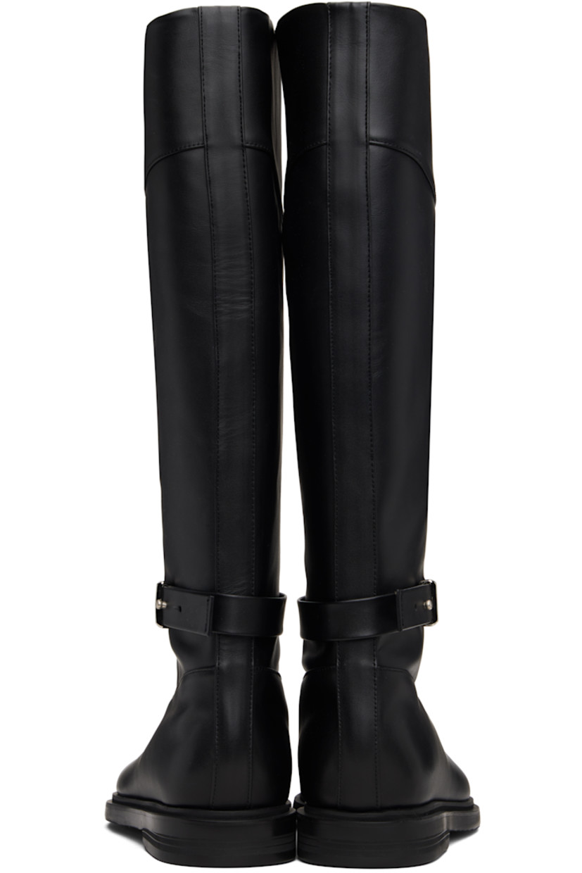 Knee-high buffed leather boots. 

· Post-stud strap at vamp
· Pigskin lining
· Stacked rubber midsole 
· Treaded rubber sole 

Supplier color: Black