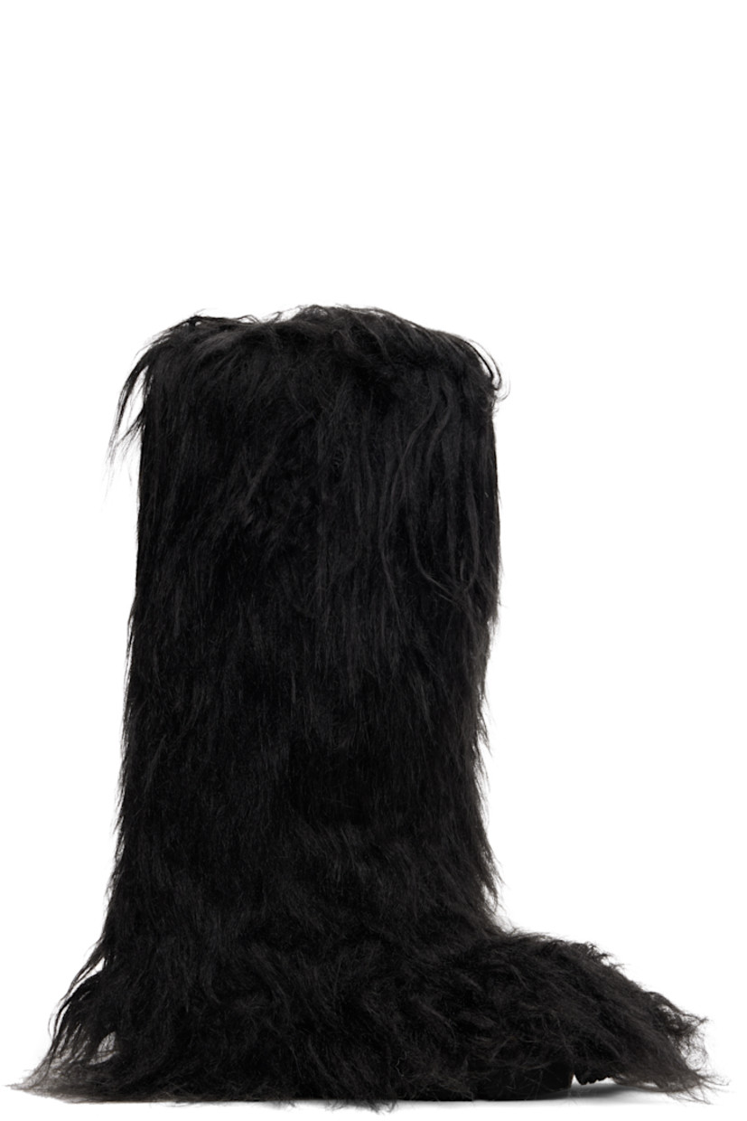 Knee-high faux-fur boots.

· Padded footbed
· Treaded rubber sole 

Supplier color: Black