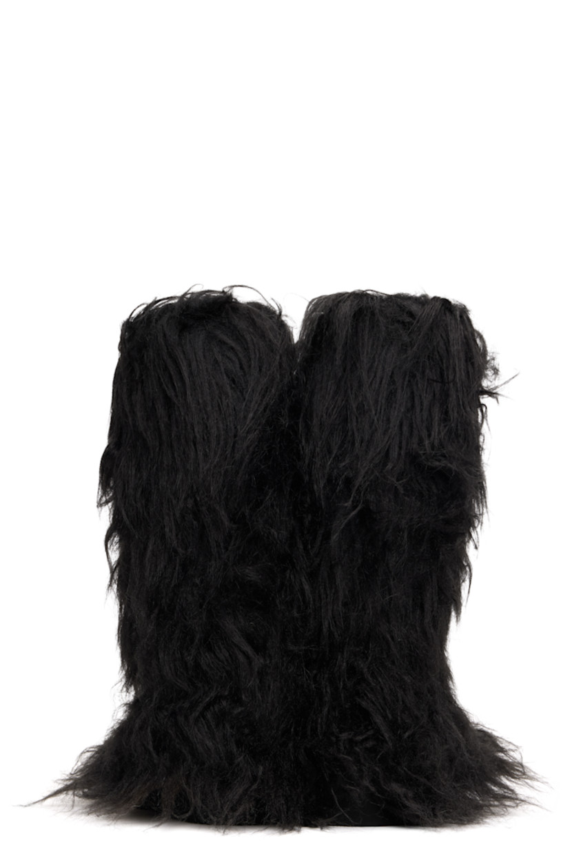 Knee-high faux-fur boots.

· Padded footbed
· Treaded rubber sole 

Supplier color: Black