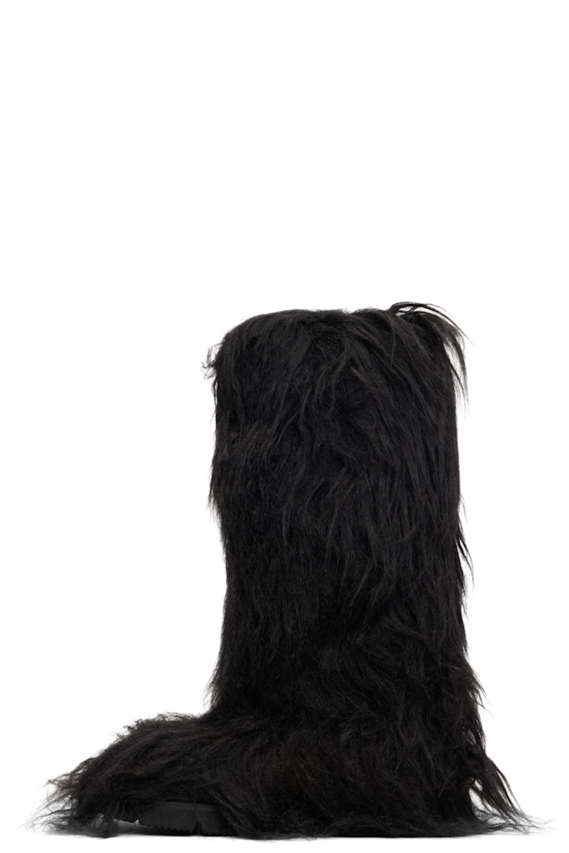 Knee-high faux-fur boots.

· Padded footbed
· Treaded rubber sole 

Supplier color: Black