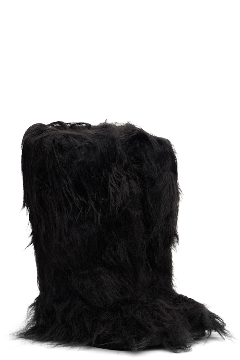 Knee-high faux-fur boots.

· Padded footbed
· Treaded rubber sole 

Supplier color: Black