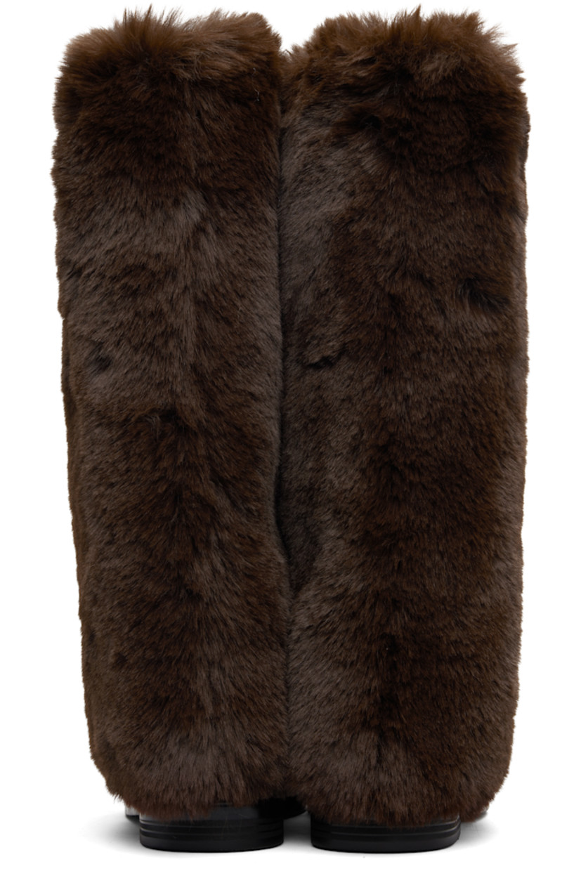 Knee-high buffed leather and faux-fur boots. 

· Pigskin lining 
· Stacked leather and rubber midsole 
· Treaded rubber sole 

Supplier color: Brown