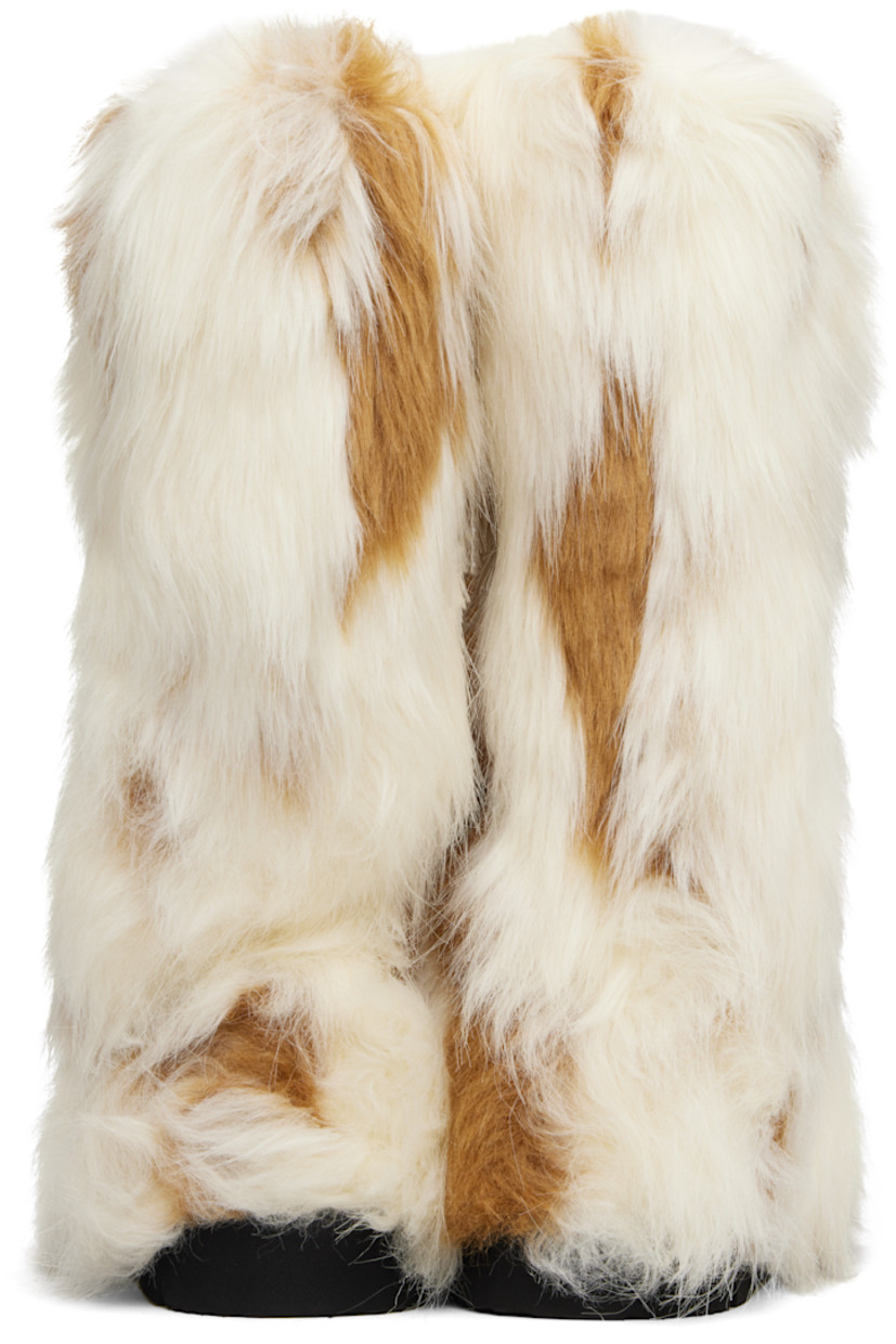 Knee-high faux-fur boots.

· Padded footbed
· Treaded rubber sole 

Supplier color: Spotted fur