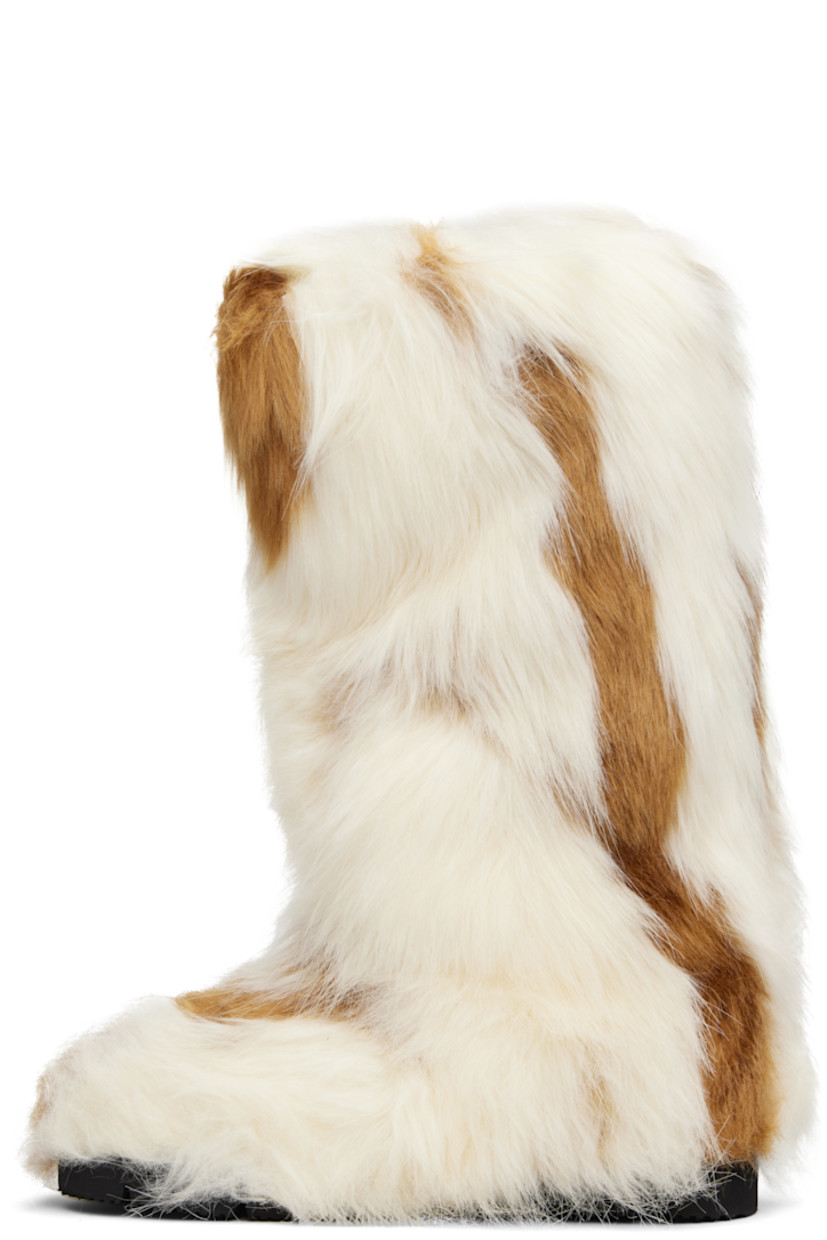 Knee-high faux-fur boots.

· Padded footbed
· Treaded rubber sole 

Supplier color: Spotted fur