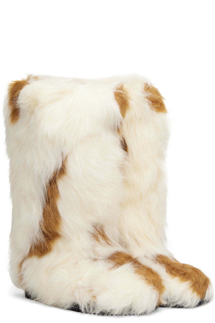Knee-high faux-fur boots.

· Padded footbed
· Treaded rubber sole 

Supplier color: Spotted fur