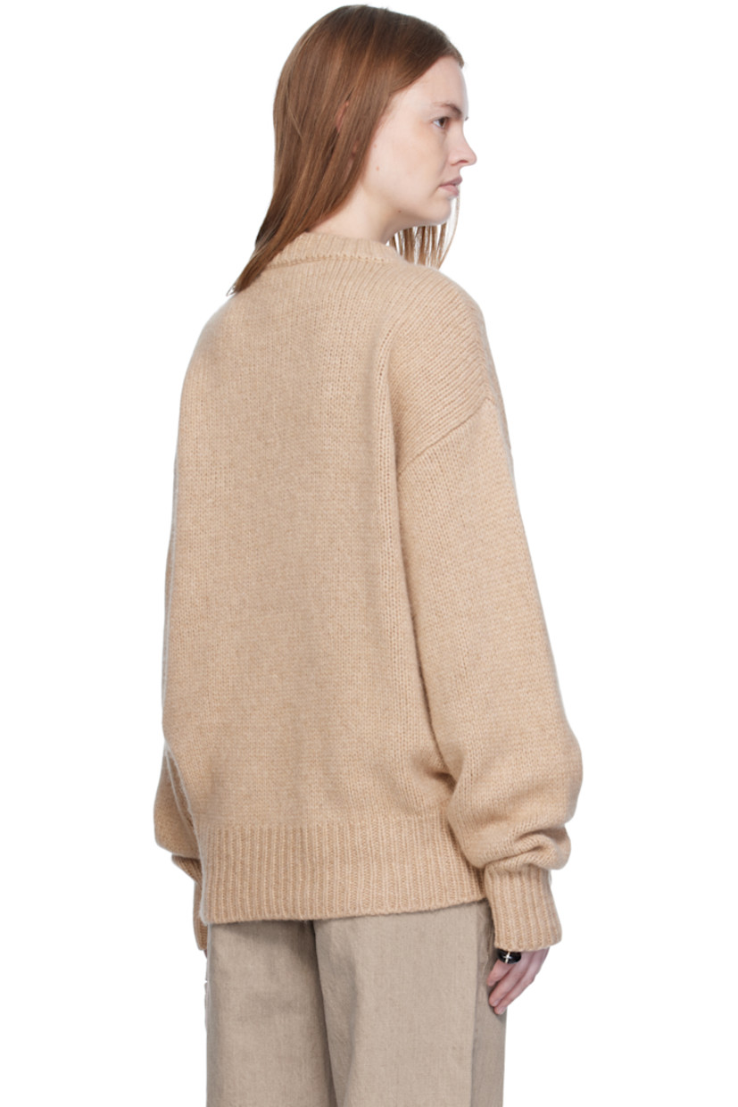Knit cashmere- and baby yak-blend sweater.

· Rib-knit crewneck, hem, and cuffs
· Dropped shoulders

Supplier color: Beige