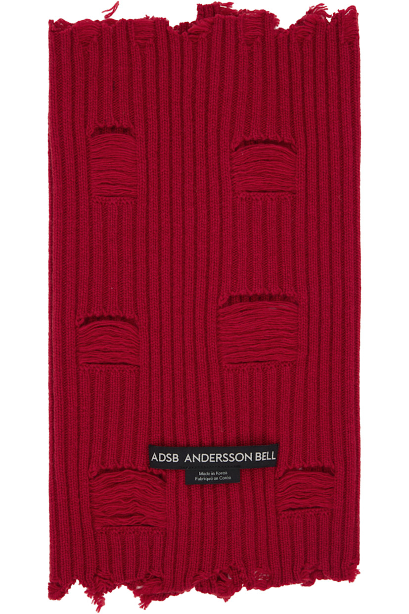 Rectangular rib-knit wool-blend tube scarf.

· Laddering and raw edges throughout
· Button closure 
· Logo patch at back face
· Mismatched oxidized hardware

Supplier color: Scarlet