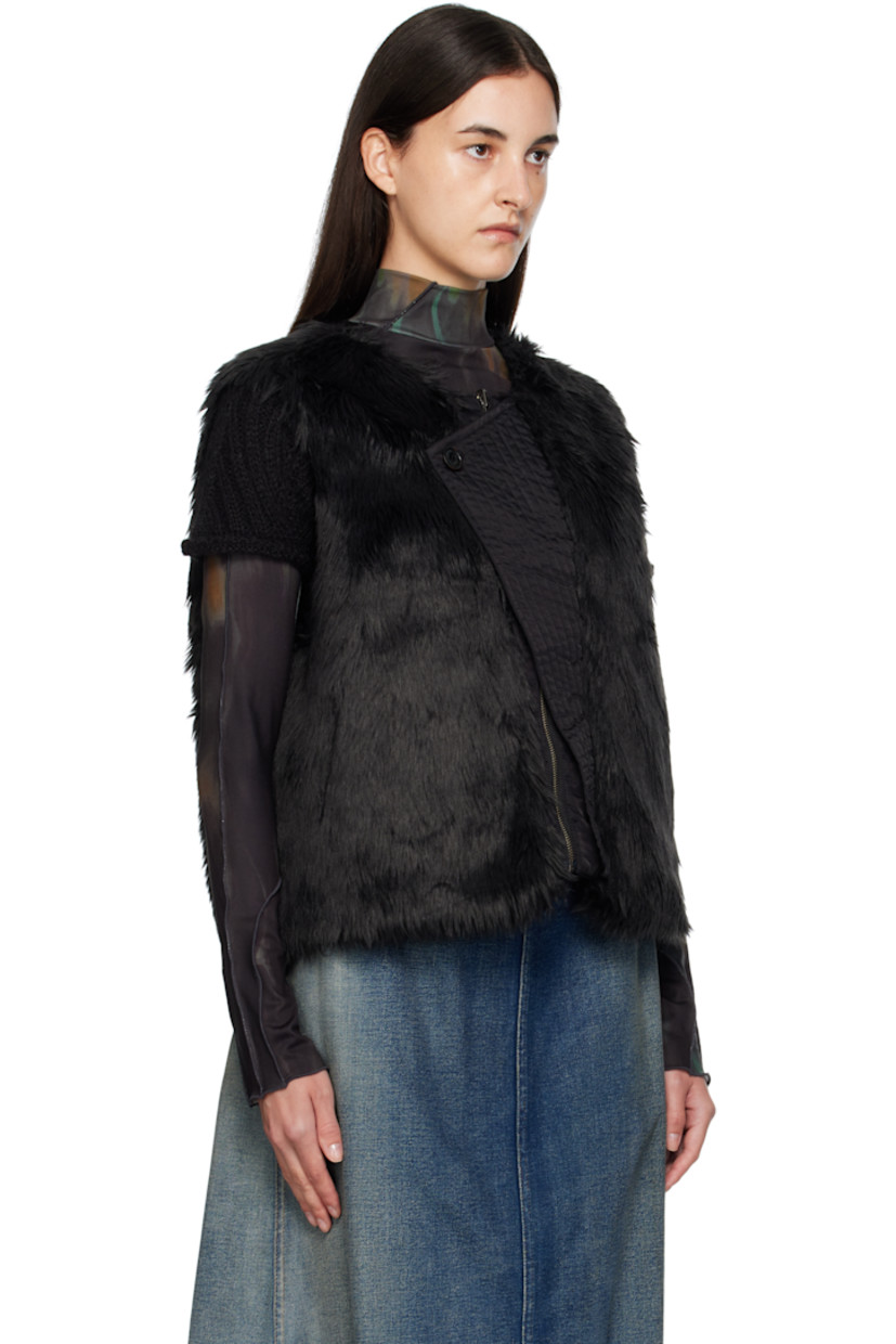 Reversible padded faux-fur vest.

Reverse in black nylon satin twill.

· Round neck
· Zip closure
· Offset quilted button placket
· Welt pockets at waist and interior

Supplier color: Black
