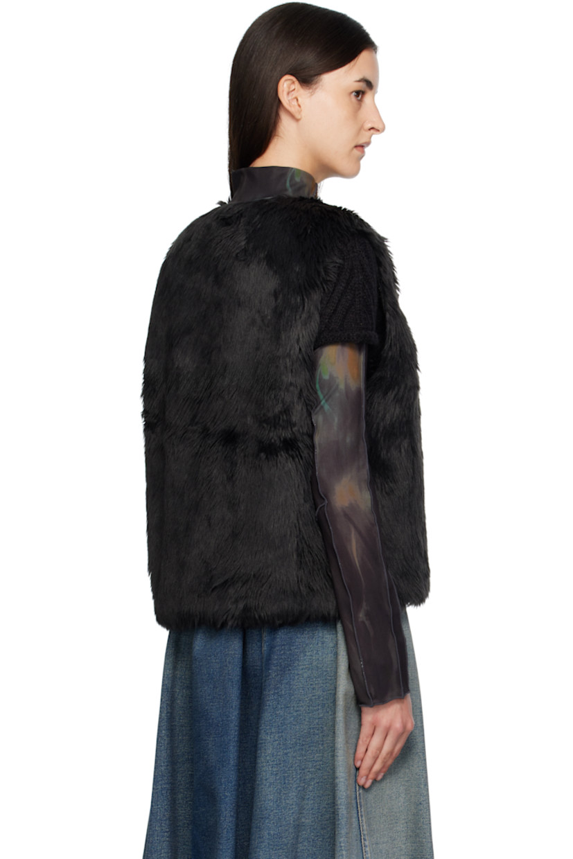 Reversible padded faux-fur vest.

Reverse in black nylon satin twill.

· Round neck
· Zip closure
· Offset quilted button placket
· Welt pockets at waist and interior

Supplier color: Black