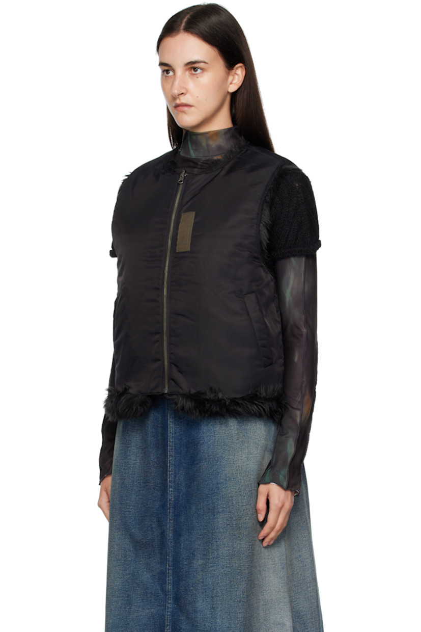 Reversible padded faux-fur vest.

Reverse in black nylon satin twill.

· Round neck
· Zip closure
· Offset quilted button placket
· Welt pockets at waist and interior

Supplier color: Black
