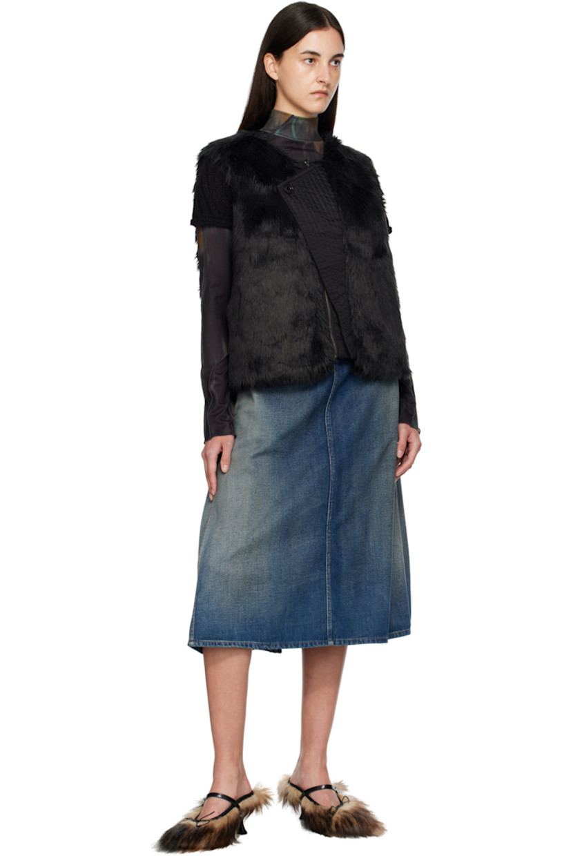 Reversible padded faux-fur vest.

Reverse in black nylon satin twill.

· Round neck
· Zip closure
· Offset quilted button placket
· Welt pockets at waist and interior

Supplier color: Black