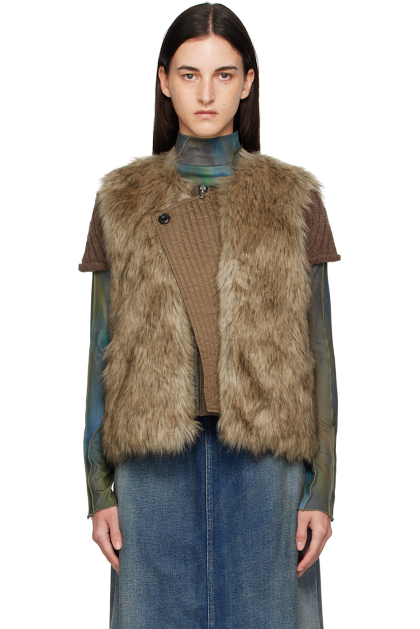 Reversible padded faux-fur vest.

Reverse in brown grained faux-leather.

· Round neck
· Zip closure
· Offset quilted button placket
· Welt pockets at waist and interior

Supplier color: Brown