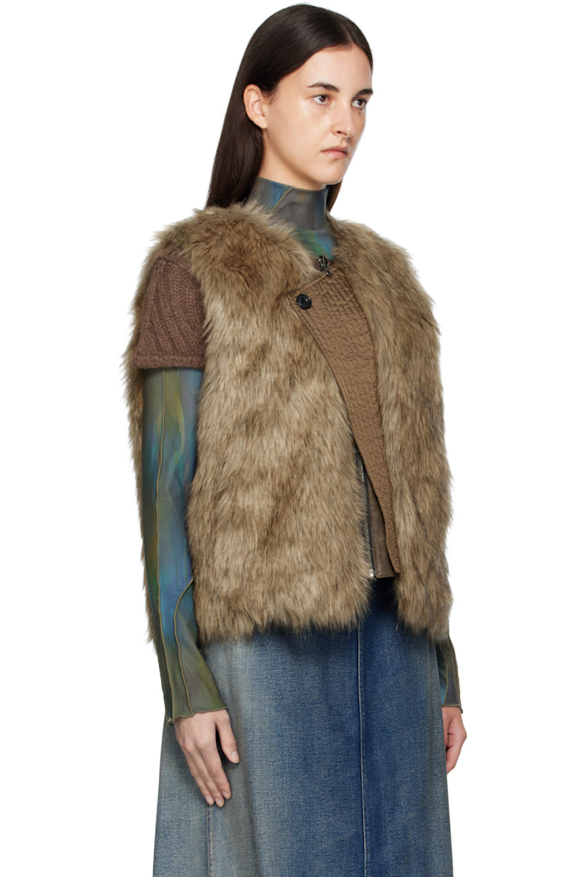 Reversible padded faux-fur vest.

Reverse in brown grained faux-leather.

· Round neck
· Zip closure
· Offset quilted button placket
· Welt pockets at waist and interior

Supplier color: Brown