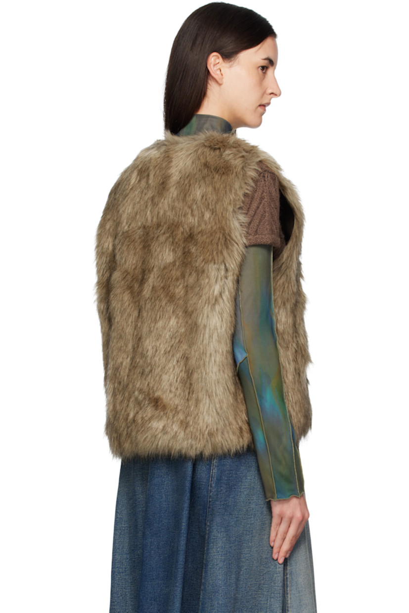 Reversible padded faux-fur vest.

Reverse in brown grained faux-leather.

· Round neck
· Zip closure
· Offset quilted button placket
· Welt pockets at waist and interior

Supplier color: Brown