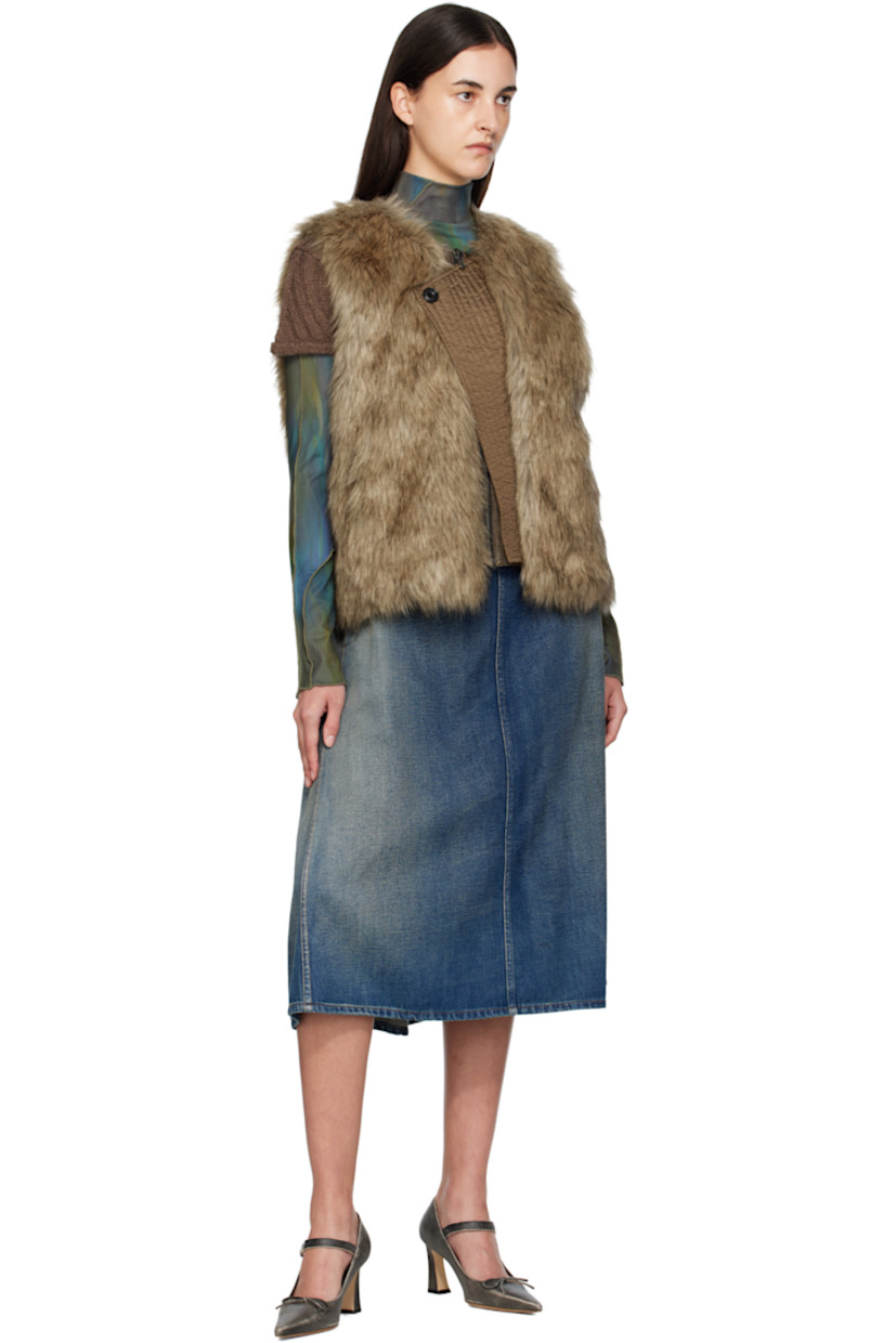 Reversible padded faux-fur vest.

Reverse in brown grained faux-leather.

· Round neck
· Zip closure
· Offset quilted button placket
· Welt pockets at waist and interior

Supplier color: Brown