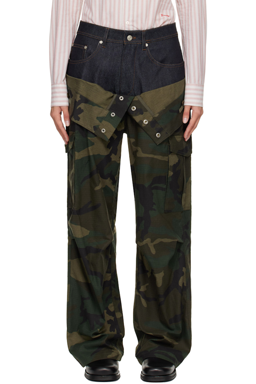Cotton-blend ripstop and non-stretch denim cargo pants.

· Camouflage pattern printed throughout
· Layered foldover waistband
· Belt loops
· Five-pocket styling
· Zip fly
· Pleats at knees
· Loops and cargo pocket at outseams
· Contrast stitching in tan
· Logo patch at back

Supplier color: Navy/Green
