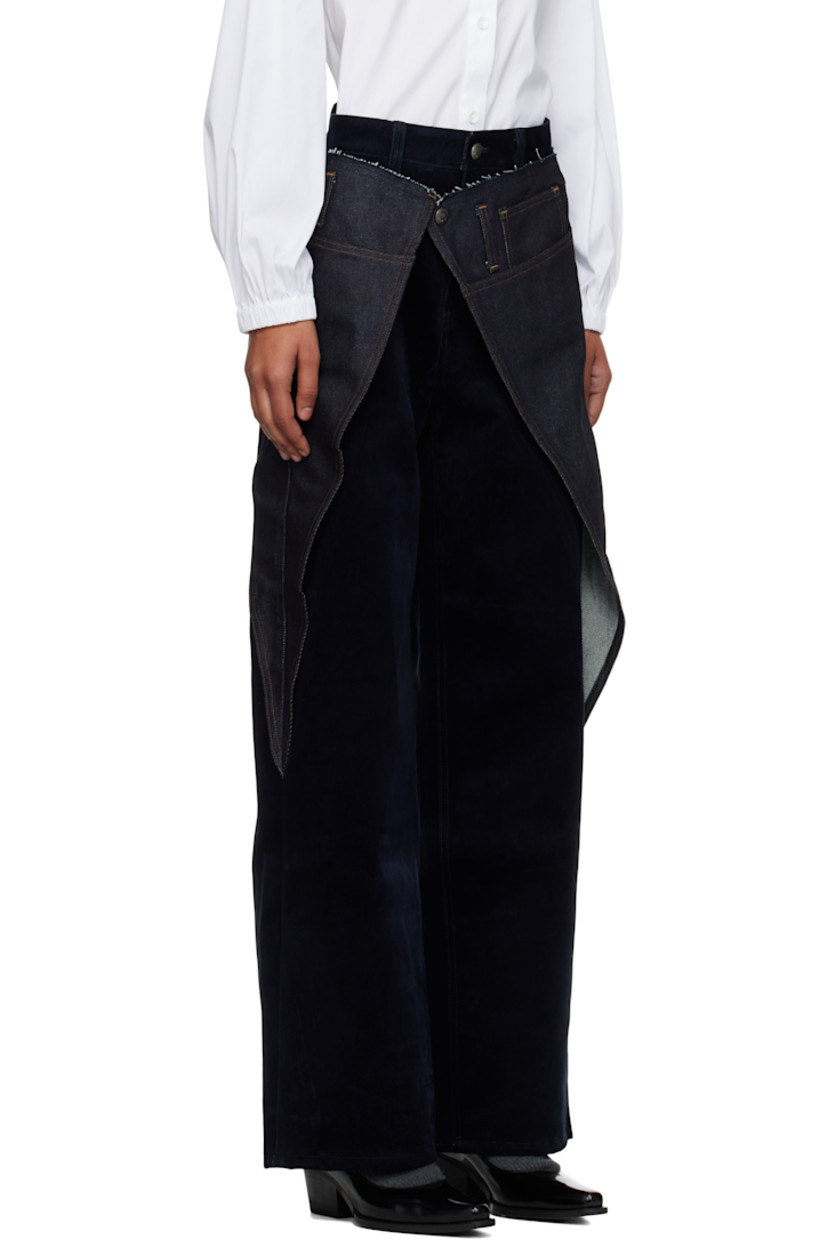 Flocked non-stretch denim jeans.

· Denim overlays with raw edges
· Belt loops
· Five-pocket styling
· Zip fly
· Cutout at outseams
· Contrast stitching in tan

Supplier color: Blue