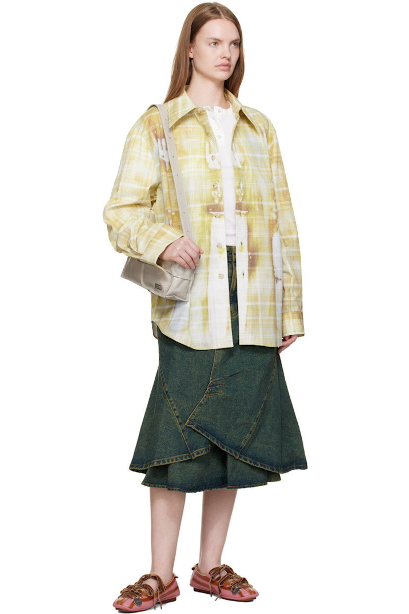 Non-stretch denim midi skirt.

· Fading and discoloration throughout
· Paneled construction
· Darts throughout
· Belt loops at waist
· Five-pocket styling
· Zip fly
· Layered hem
· Leather logo patch at back waist

Supplier color: Army green/Blue