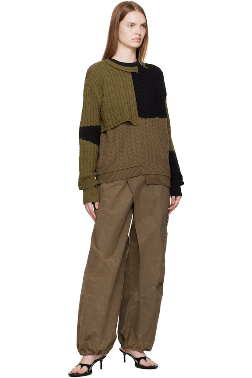 Cable-knit cotton- and wool-blend sweater.

· Assorted knit patchwork throughout
· Notched crewneck
· Overlay panel at front
· Asymmetrical hem

Supplier color: Multi