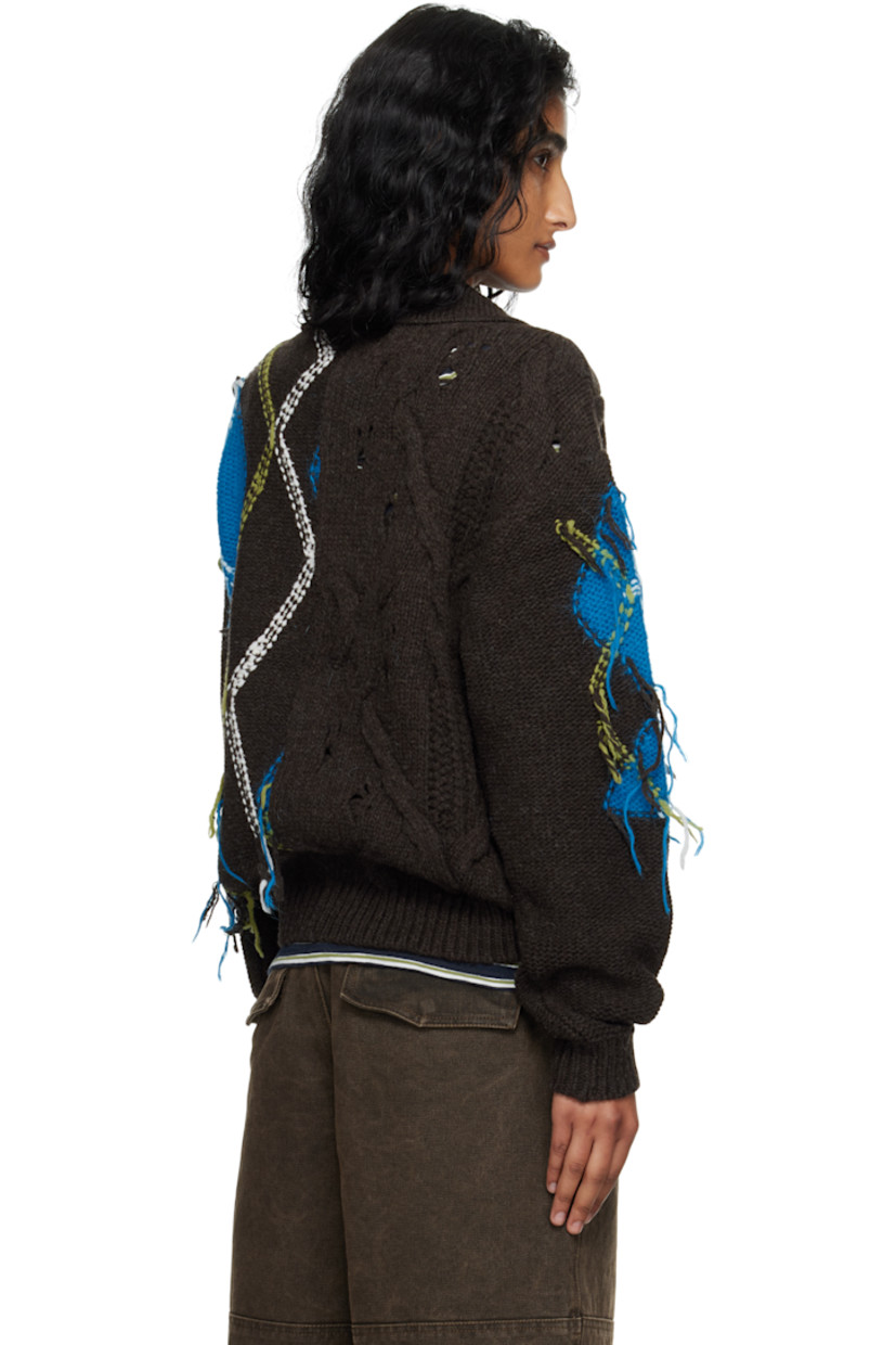 Cable-knit wool-blend polo.

· Fil-coupé and intarsia argyle pattern throughout
· Rib-knit spread collar, hem, and cuffs
· Two-button placket

Supplier color: Choco