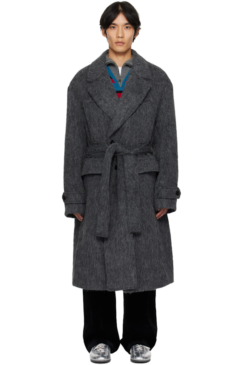 Felted alpaca- and wool-blend coat.

· Notched lapel
· Double-breasted button closure
· Welt pockets at chest
· Flap pockets at waist
· Belt loops with detachable belt at waist
· Adjustable button tab at cuffs
· Vented back hem
· Full satin lining

Supplier color: Grey