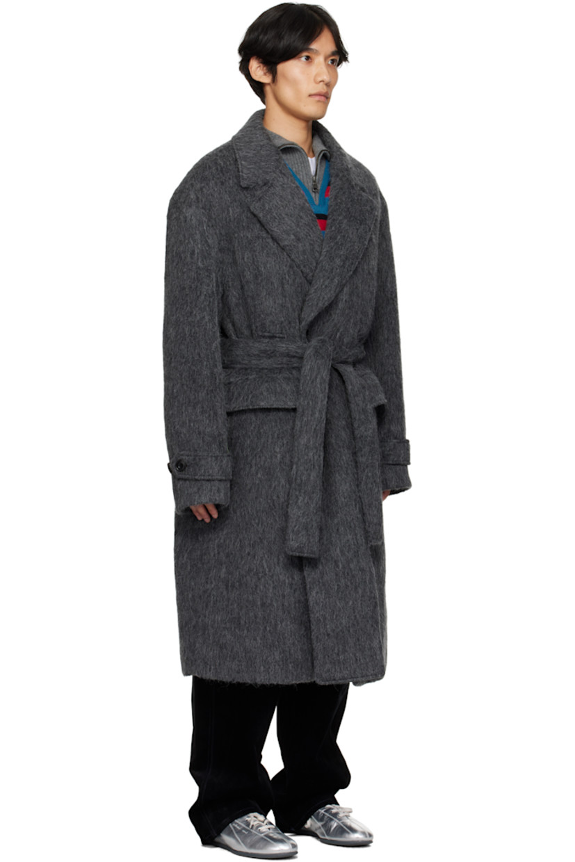 Felted alpaca- and wool-blend coat.

· Notched lapel
· Double-breasted button closure
· Welt pockets at chest
· Flap pockets at waist
· Belt loops with detachable belt at waist
· Adjustable button tab at cuffs
· Vented back hem
· Full satin lining

Supplier color: Grey