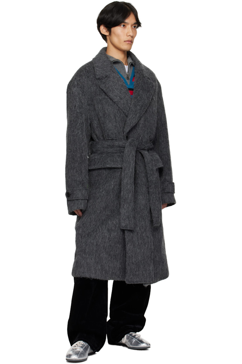 Felted alpaca- and wool-blend coat.

· Notched lapel
· Double-breasted button closure
· Welt pockets at chest
· Flap pockets at waist
· Belt loops with detachable belt at waist
· Adjustable button tab at cuffs
· Vented back hem
· Full satin lining

Supplier color: Grey