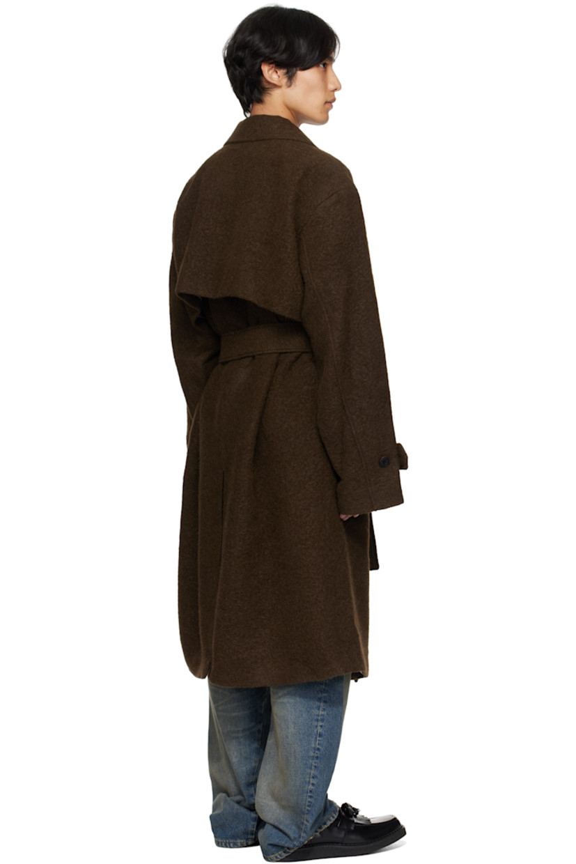 Felted alpaca- and wool-blend coat.

· Notched lapel
· Double-breasted button closure
· Welt pockets at chest
· Flap pockets at waist
· Belt loops with detachable belt at waist
· Adjustable button tab at cuffs
· Vented back hem
· Full satin lining

Supplier color: Brown