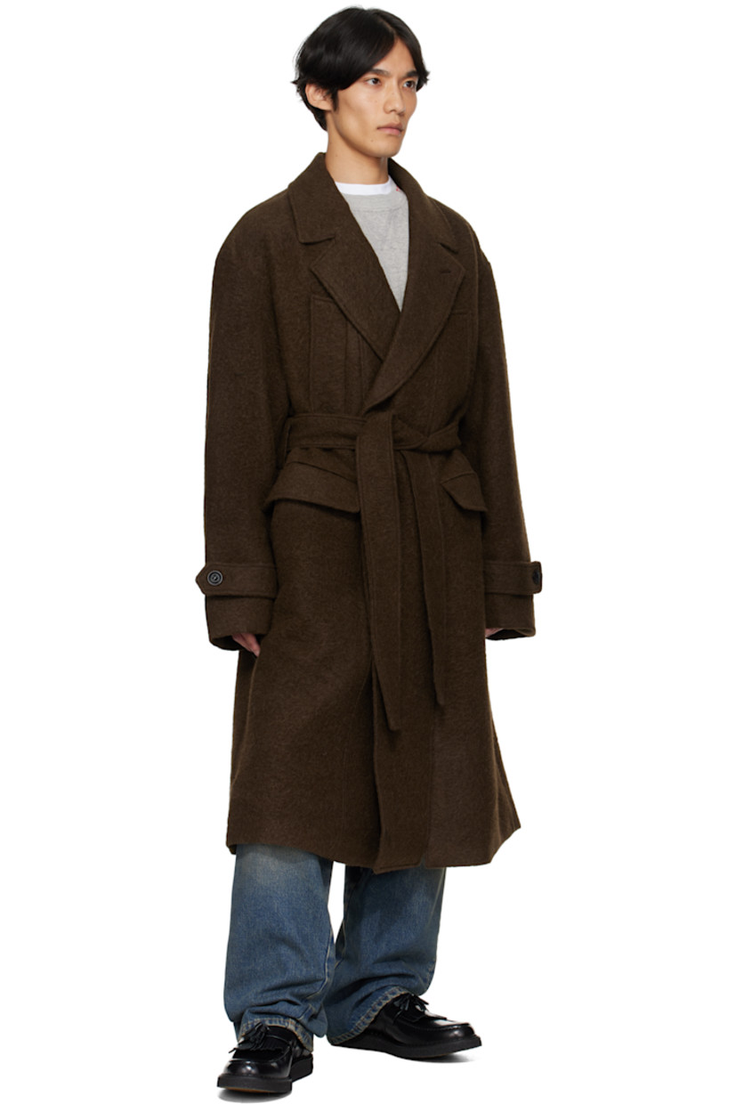 Felted alpaca- and wool-blend coat.

· Notched lapel
· Double-breasted button closure
· Welt pockets at chest
· Flap pockets at waist
· Belt loops with detachable belt at waist
· Adjustable button tab at cuffs
· Vented back hem
· Full satin lining

Supplier color: Brown
