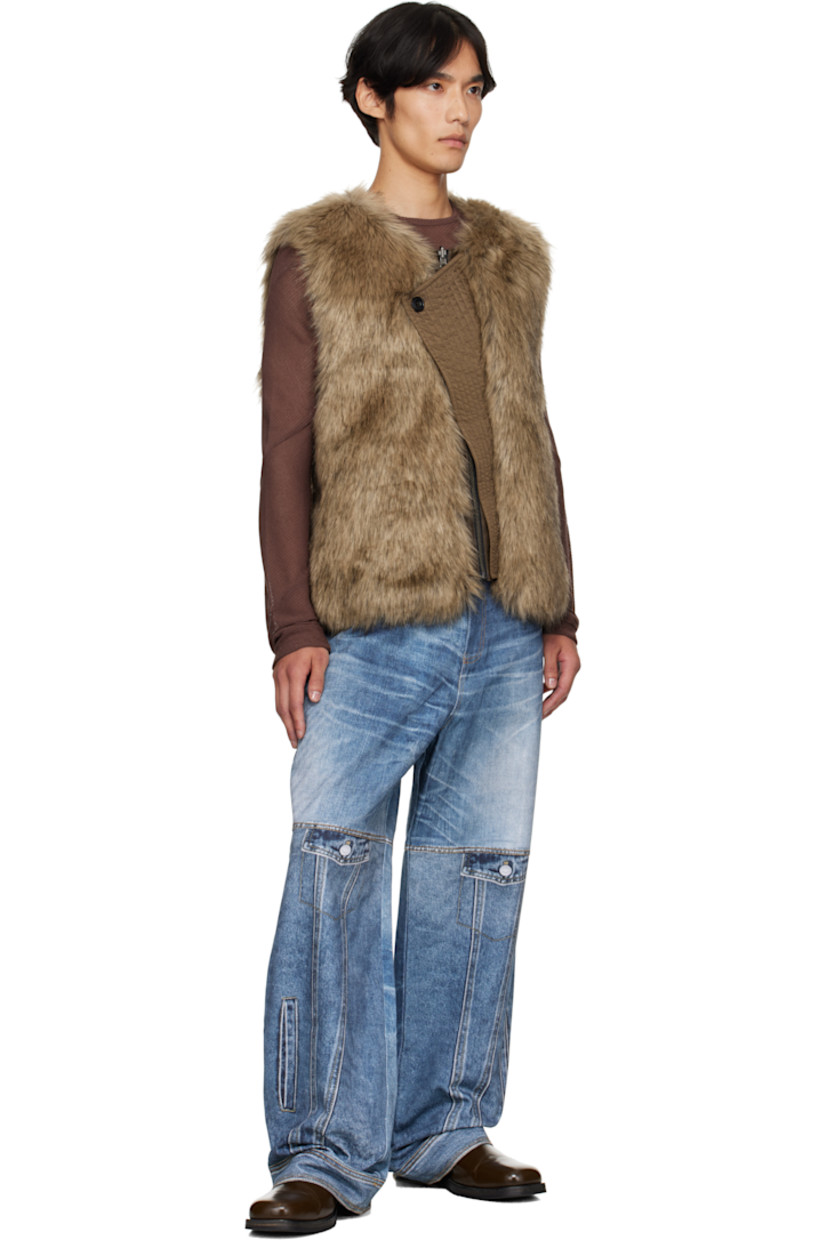 Reversible padded faux-fur vest. 

Reverse in brown grained faux-leather. Smudging throughout.

· Crewneck
· Quilted nylon twill panel at offset zip closure
· Welt pockets at waist and interior 

Supplier color: Brown