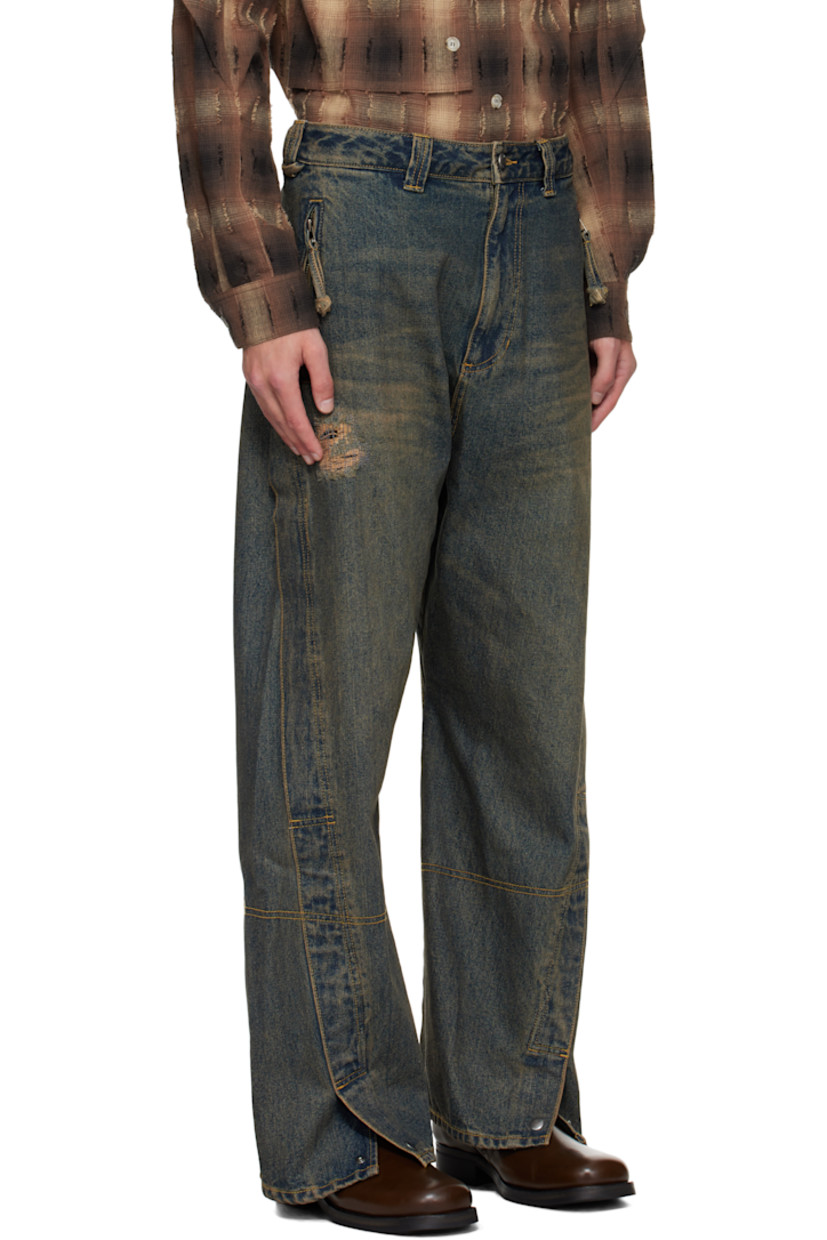 Non-stretch denim jeans.

· Fading, whiskering, and distressing throughout
· Belt loops
· Four-pocket styling
· Zip fly
· Press-stud vent at cuffs
· Twisted outseams
· Logo patch at back waistband
· Contrast stitching in tan

Supplier color: Dusty blue