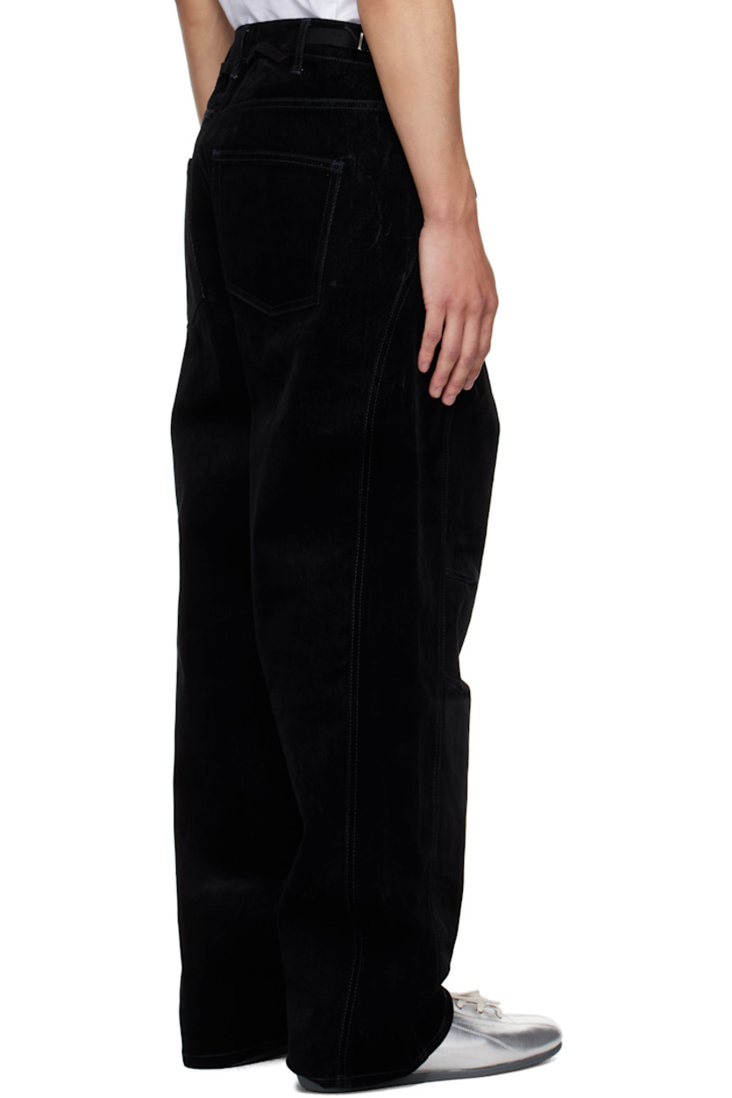Heavyweight cotton corduroy trousers.

· Belt loops at asymmetrical waistband
· Five-pocket styling
· Modified button fly
· Darts at knees
· Cinch tabs at back waistband
· Webbing loops at waistband

Supplier color: Black