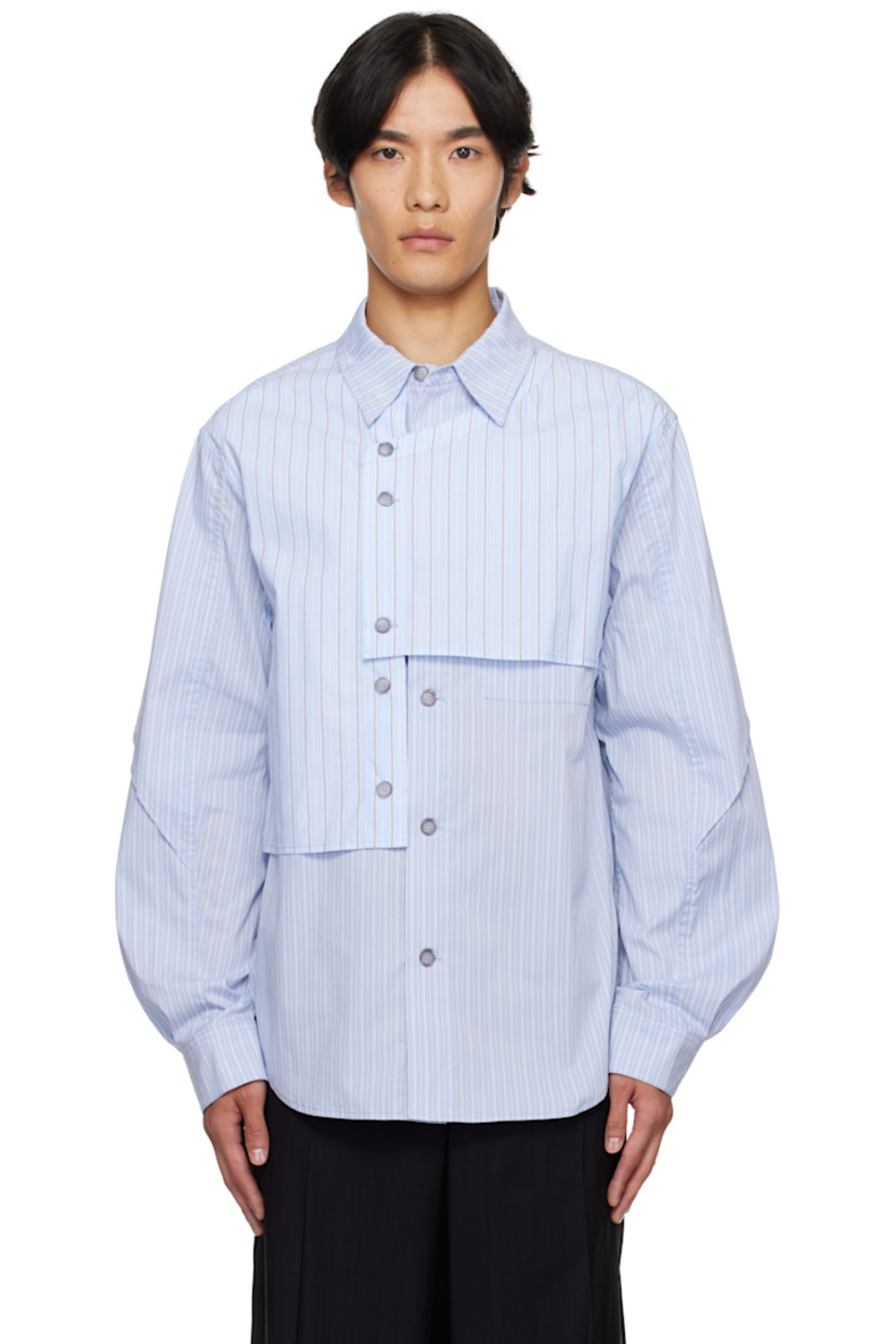 Stretch cotton-blend poplin shirt.

· Asymmetrical construction
· Stripes throughout
· Spread collar
· Overlay with button fastenings at front
· Button closure
· Shirttail hem
· Buttoned barrel cuffs
· Box pleat at back yoke

Supplier color: Blue