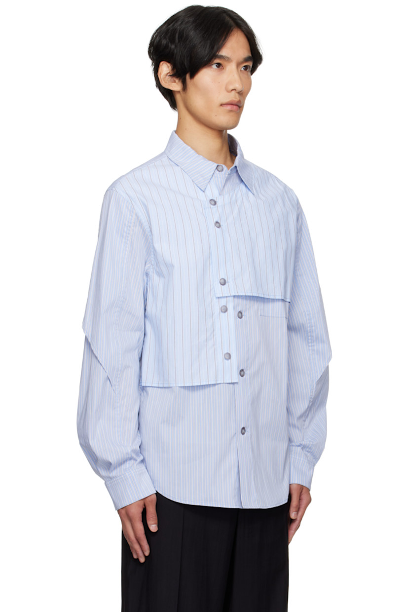 Stretch cotton-blend poplin shirt.

· Asymmetrical construction
· Stripes throughout
· Spread collar
· Overlay with button fastenings at front
· Button closure
· Shirttail hem
· Buttoned barrel cuffs
· Box pleat at back yoke

Supplier color: Blue