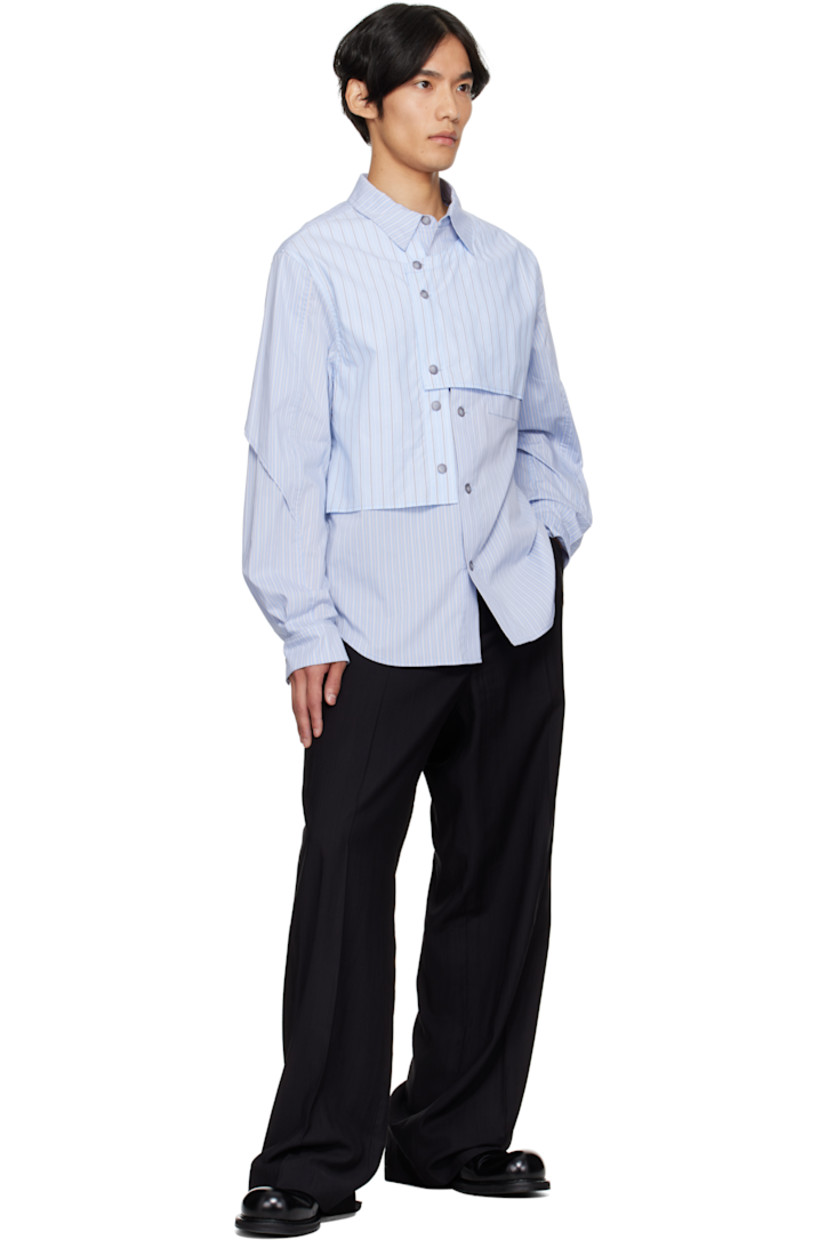 Stretch cotton-blend poplin shirt.

· Asymmetrical construction
· Stripes throughout
· Spread collar
· Overlay with button fastenings at front
· Button closure
· Shirttail hem
· Buttoned barrel cuffs
· Box pleat at back yoke

Supplier color: Blue