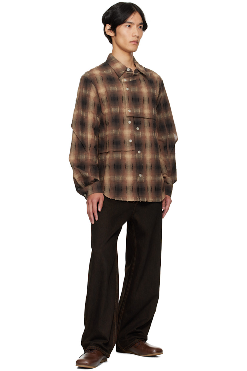 Plain-woven cotton-blend shirt.

· Check and fil-coupé pattern throughout
· Spread collar
· Overlay with button fastenings at front
· Button closure
· Shirttail hem
· Buttoned barrel cuffs
· Box pleat at back yoke

Supplier color: Brown