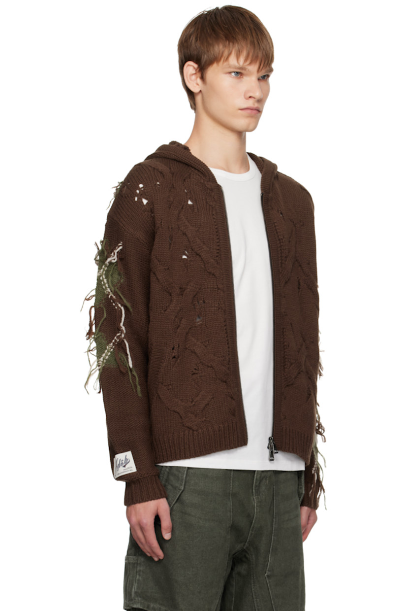 Cable-knit wool-blend hoodie.

· Fil-coupé argyle pattern throughout
· Rib-knit trim at hood, hem, and cuffs
· Two-way zip closure
· Welt pockets at front
· Logo patch at cuff

Supplier color: Brown