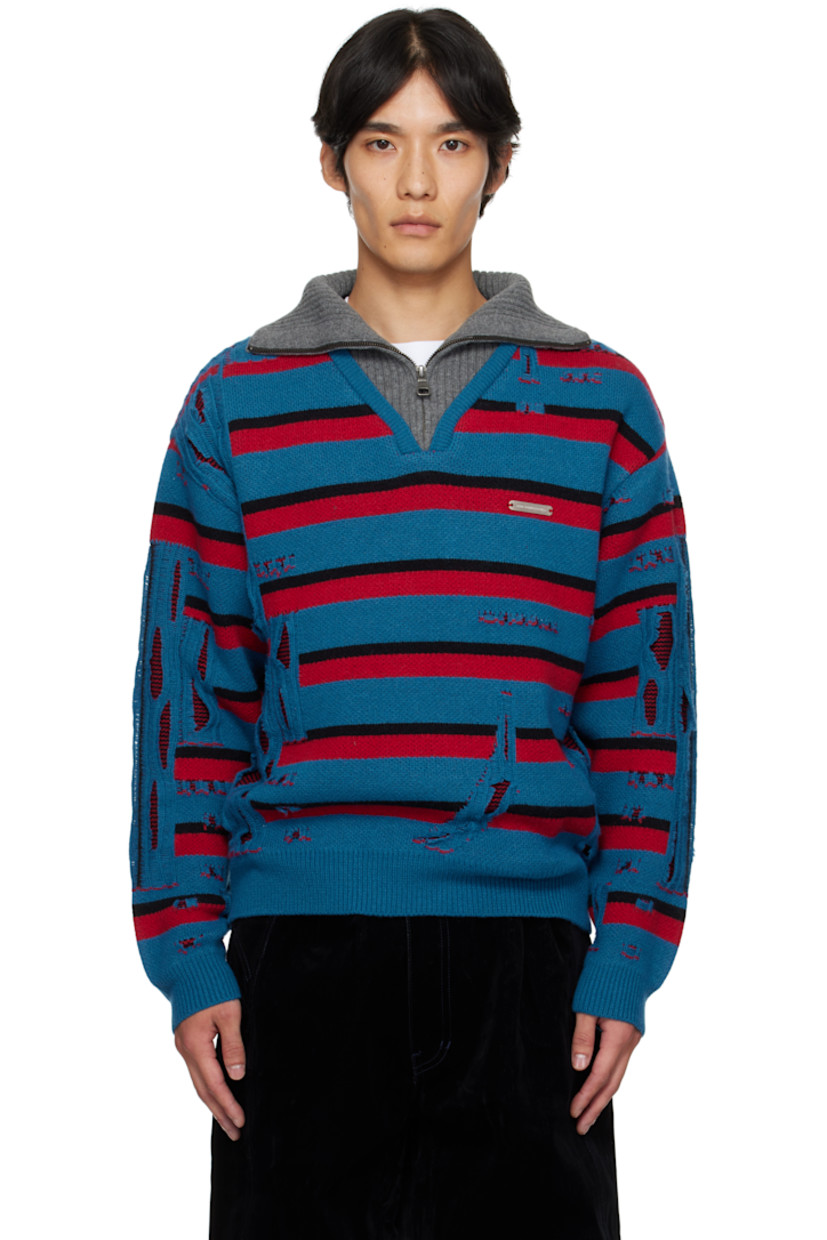 Heavyweight knit wool-blend sweater.

· Laddering, raw edges, and stripes throughout
· Stand collar with half-zip placket
· Rib-knit collar, hem, and cuffs
· Paneled V-neck 
· Logo hardware at chest

Supplier color: Multi blue/Red
